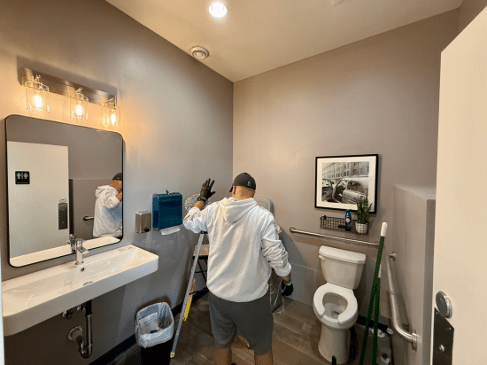 a person standing in front of a mirror posing for the camera