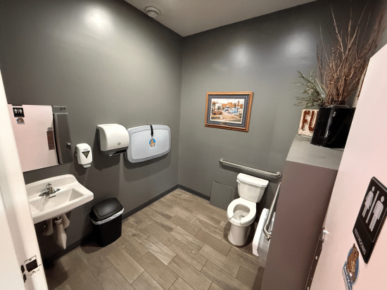 a room with a sink and a mirror