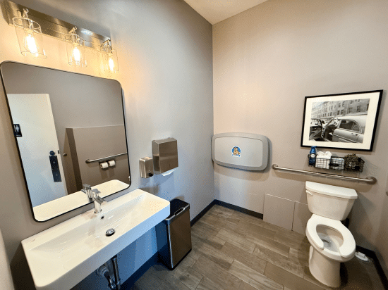 a room with a sink and a mirror