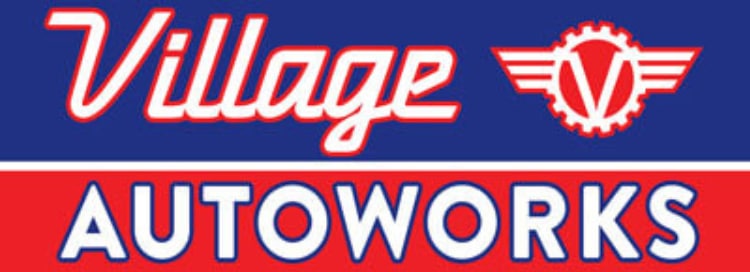 Logo of Village Autoworks with a blue and red background featuring a gear and wings symbol.